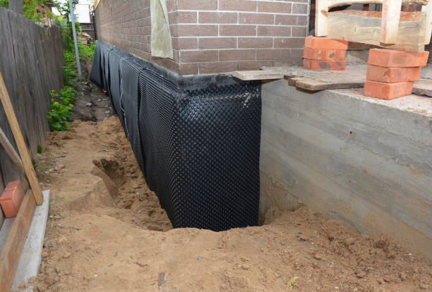 Happy homeowners after waterproofing job in Lawrenceville